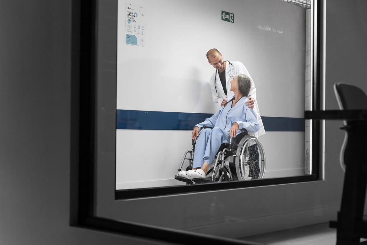 full-shot-doctor-patient-wheelchair